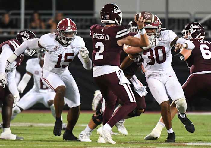 Alabama Crimson Tide linebacker Dallas Turner (15) and Alabama Crimson Tide linebacker Jihaad Campbell (30) put pressure on Mississippi State Bulldogs quarterback Will Rogers (2) in Davis Wade Stadium.